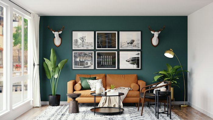 Living room with a deep green painted feature wall.