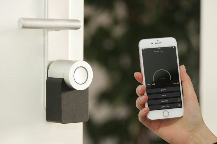Smart door lock being operated from a phone.